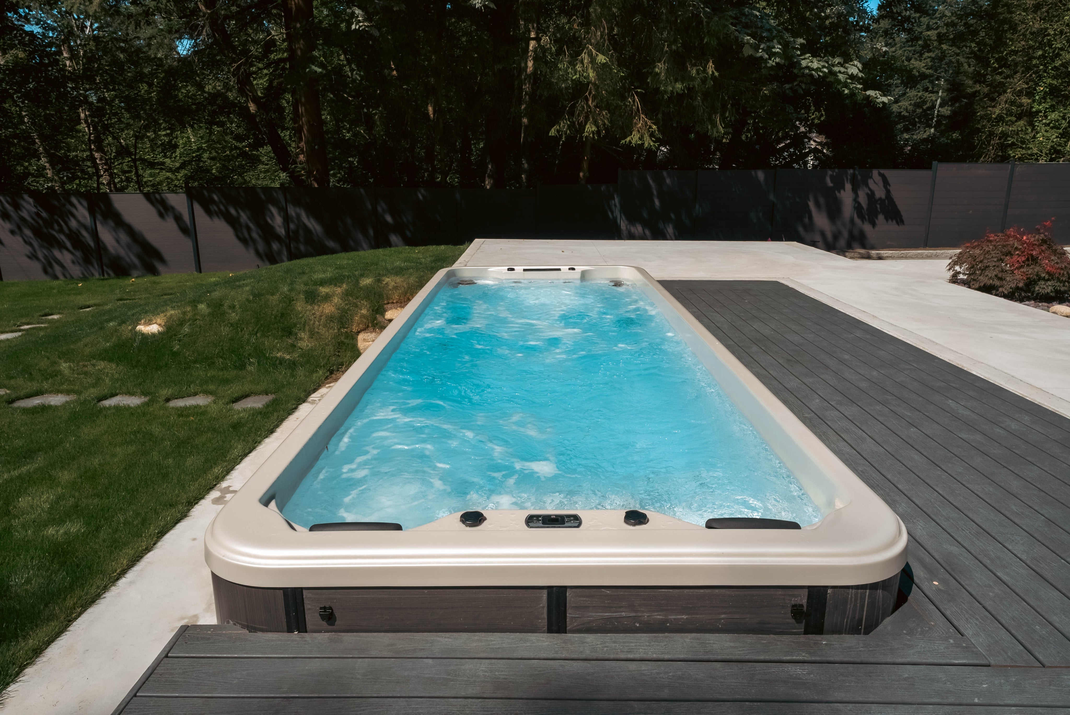 Luxx swim spa installed in backyard